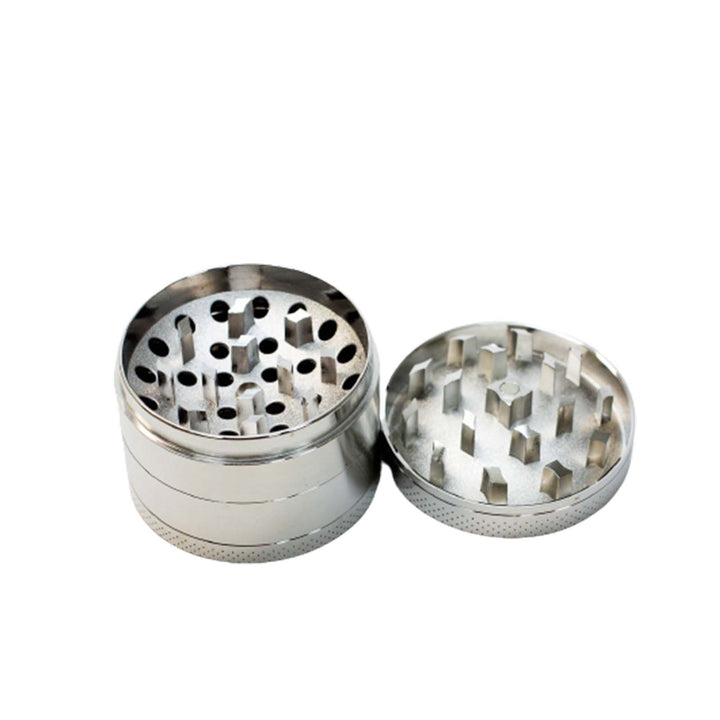 2.15 inch steel herb grinder with lid removed to show grinding chamber and sharp teeth