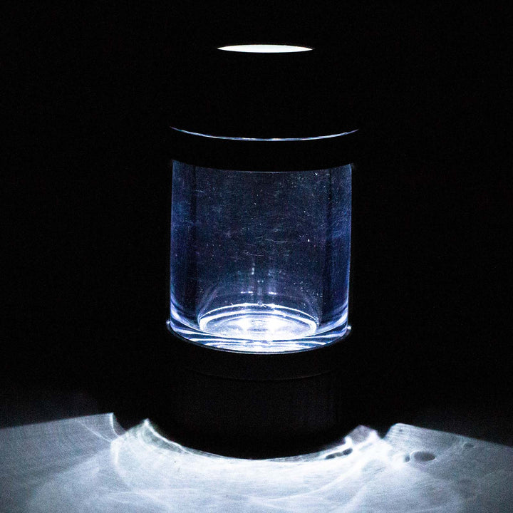 lluminated 4-in-1 LED Magnify Jar with Grinder glowing with built-in LED lights