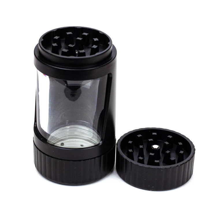 Open grinder compartment of the 4-in-1 LED Magnify Jar showing grinding teeth