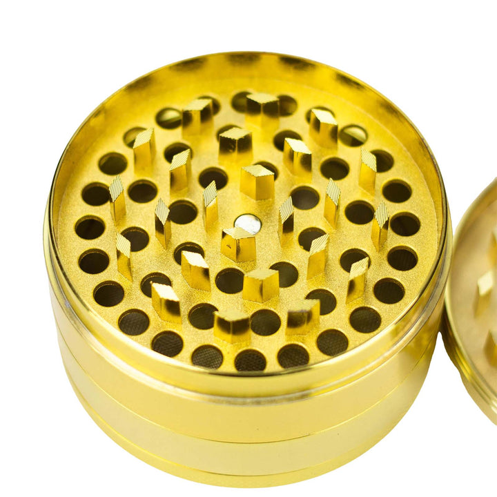Diamond-shaped CNC teeth inside Acid Secs 75mm herb grinder