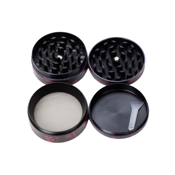 Flat lay of all four pieces of the Dark Floral 4-Piece Weed Grinder including lid, grinding chamber, screen, and kief catcher