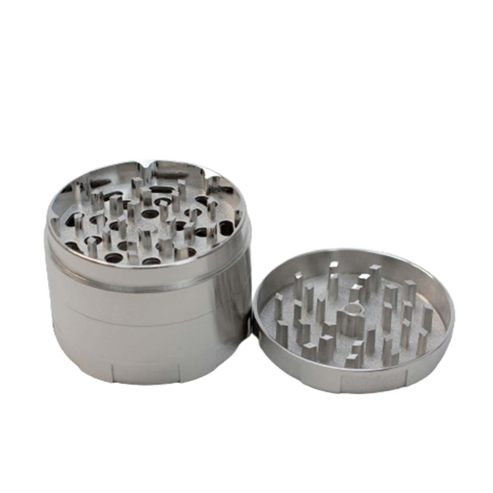 Grinding chamber of GHOST Large Herb Grinder showing sharp aluminum teeth