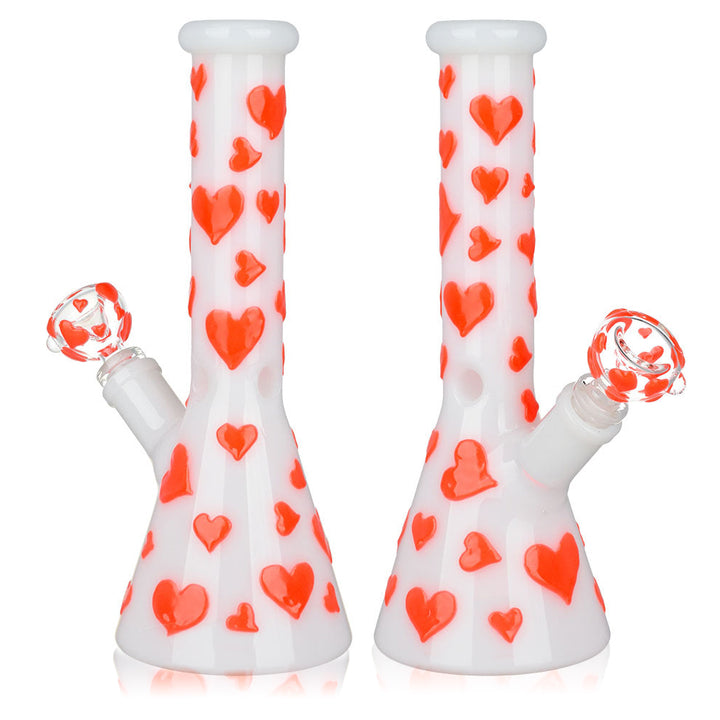Left and right side comparison of Glow In The Dark Heart Beaker Water Bong showcasing detailed heart design