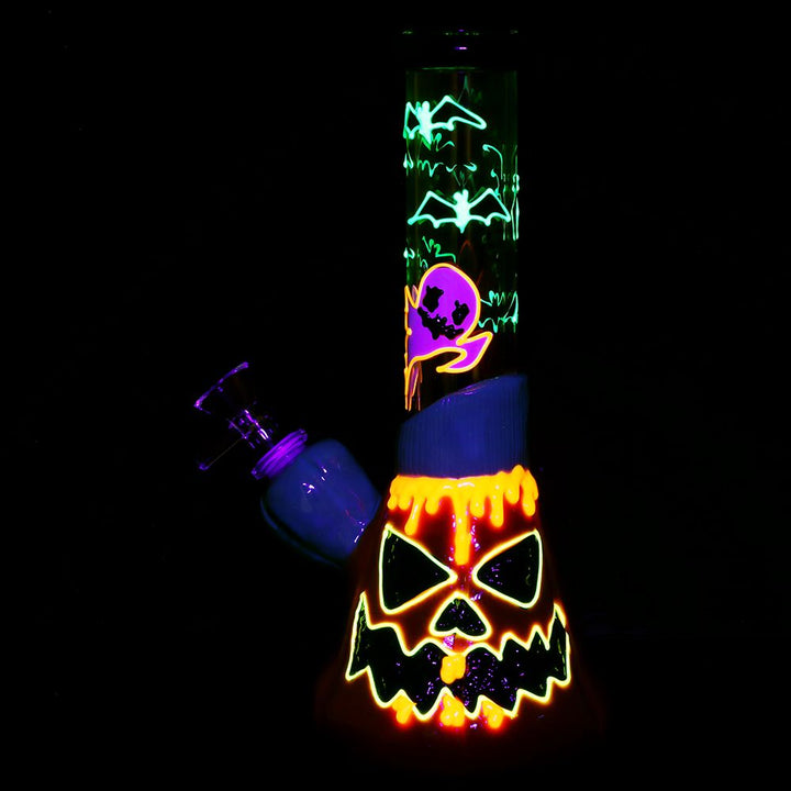 Halloween Glow-in-Dark Jack-O'-Lantern Bong glowing in the dark showcasing luminous Halloween accents