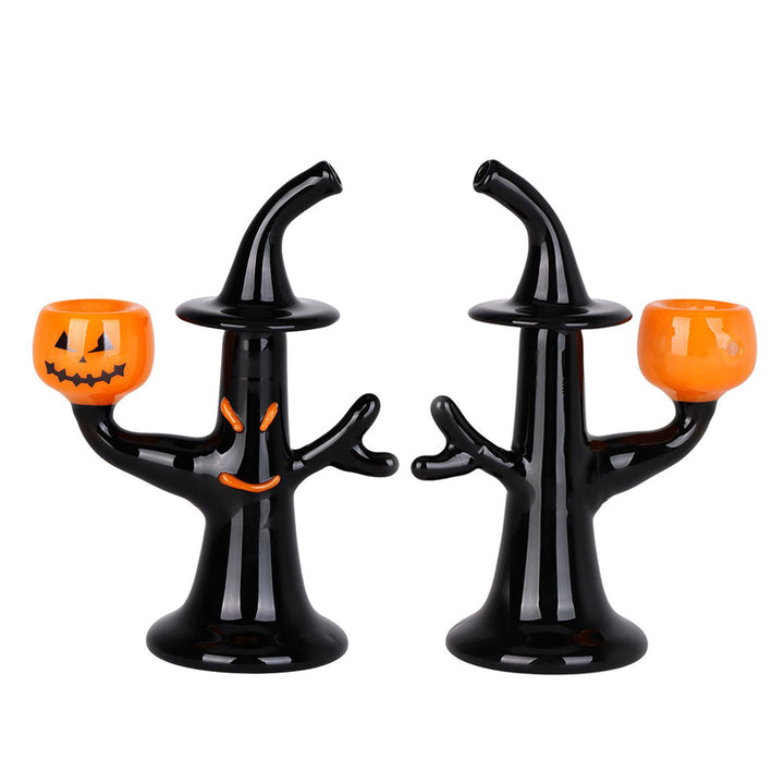 Front and back view of Halloween Jack-O'-Lantern Witch Hand Pipe displaying glowing eyes, carved bowl, and black tree design