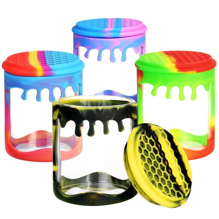 Collection of Gotoke Honeycomb Dab Containers showing blue purple, rasta, black yellow, and rainbow colors