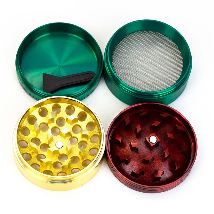 Flat lay of Infyniti 50mm Zinc Herb Grinder showcasing all 4 pieces