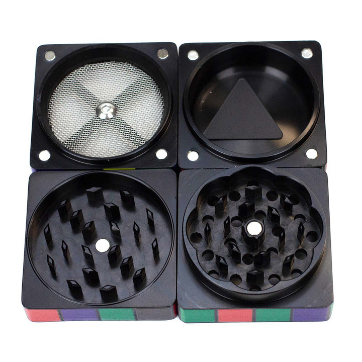 Disassembled Infyniti cube grinder showing all four parts and compartments