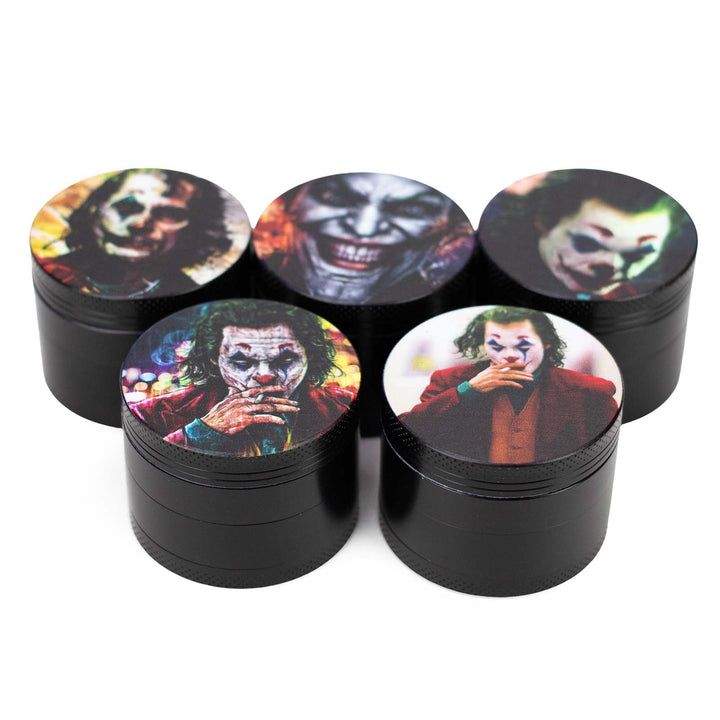 Assorted Joker-themed herb grinder designs in 2 inch size