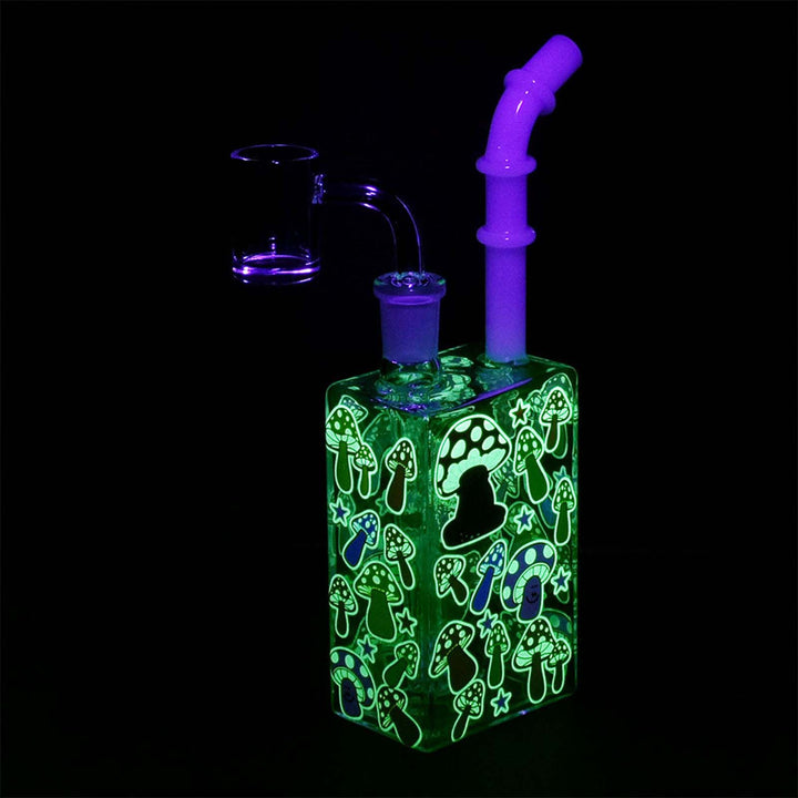 ushroom Juice Box Dab Rig glowing in the dark – luminous glass rig with mushroom artwork