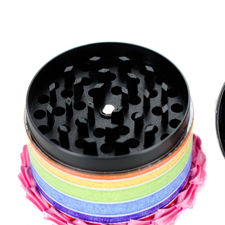 Sharp metal teeth inside Peachy Rainbow Grinder for fine and even herb grinding