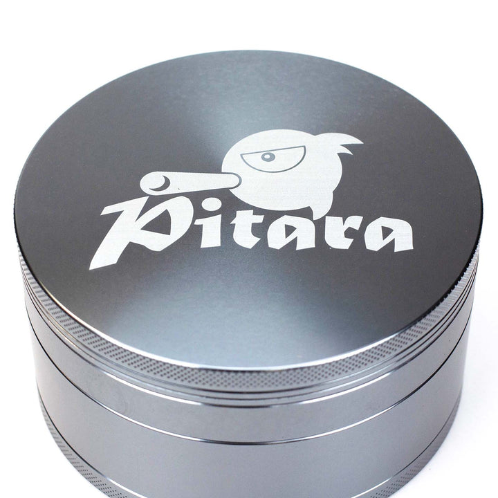 Top view of Pitara Aluminum 100mm Extra Large Herb Grinder showing the logo on the lid