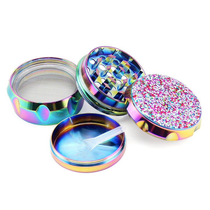 Four-piece Girly Weed Grinder with kief catcher, pollen screen, and scraper tool