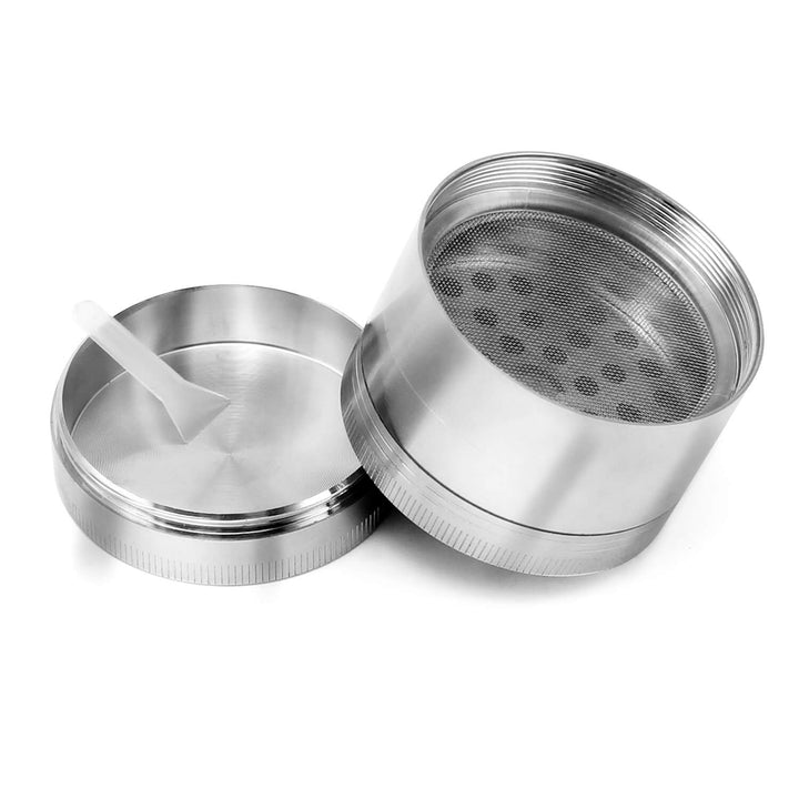 Two separated pieces of the Mandala herb grinder