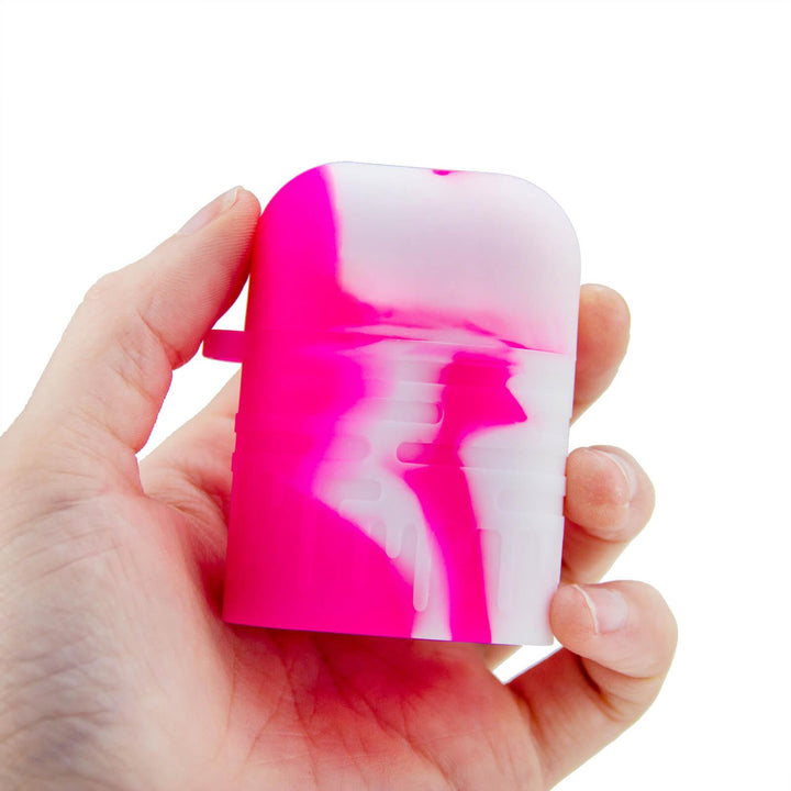Pink Silicone Dugout One Hitter Set Shown in Hand for Scale